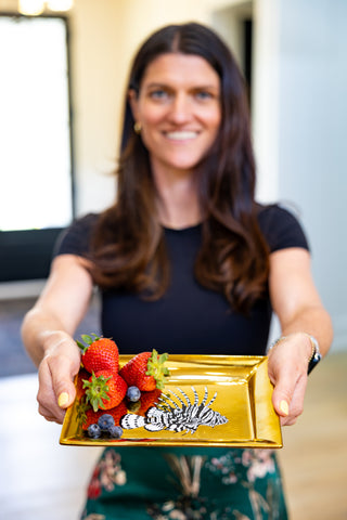 Beautifully arranged Season and Stir™ Gold Reef Treasure Tray on a dining table, enhancing the atmosphere with luxury decor accents.